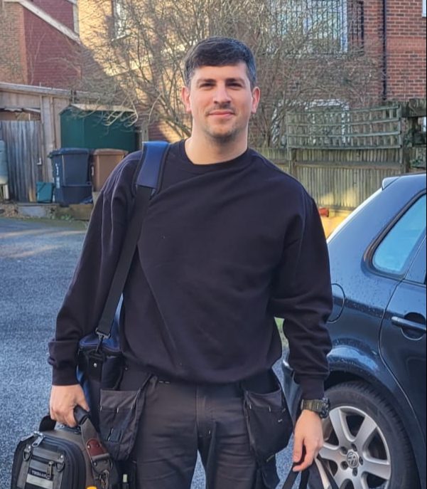 Lorenzo from Ferraro Plumbing & Heating with his tool bags, ready for a job in Guildford